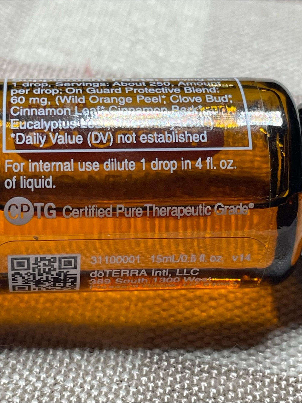 Doterra On Guard Essential Oil Bottle with Orange Label and Black Cap - Picture 3 of 5